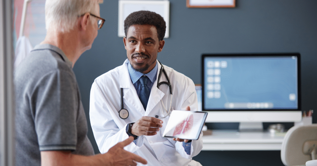 Independent physician discussing ACO REACH value-based care options with a Medicare patient