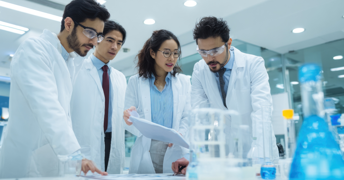 Physician-led care team reviewing ACO REACH performance data and shared savings reports on a computer