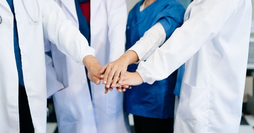 Coordinated Care Through Hospitalist Collaboration | ASAAR Medical Hospitalist team working with primary care providers to coordinate patient transitions under the ACO REACH model.