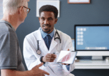 Independent physician discussing ACO REACH value-based care options with a Medicare patient